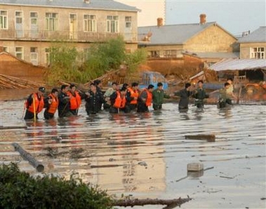 The rescue team search for victims in a primary school hit by a flash flood in Shalan town in Ning'an city, northeast China's Heilongjiang province Friday, June 10, 2005.